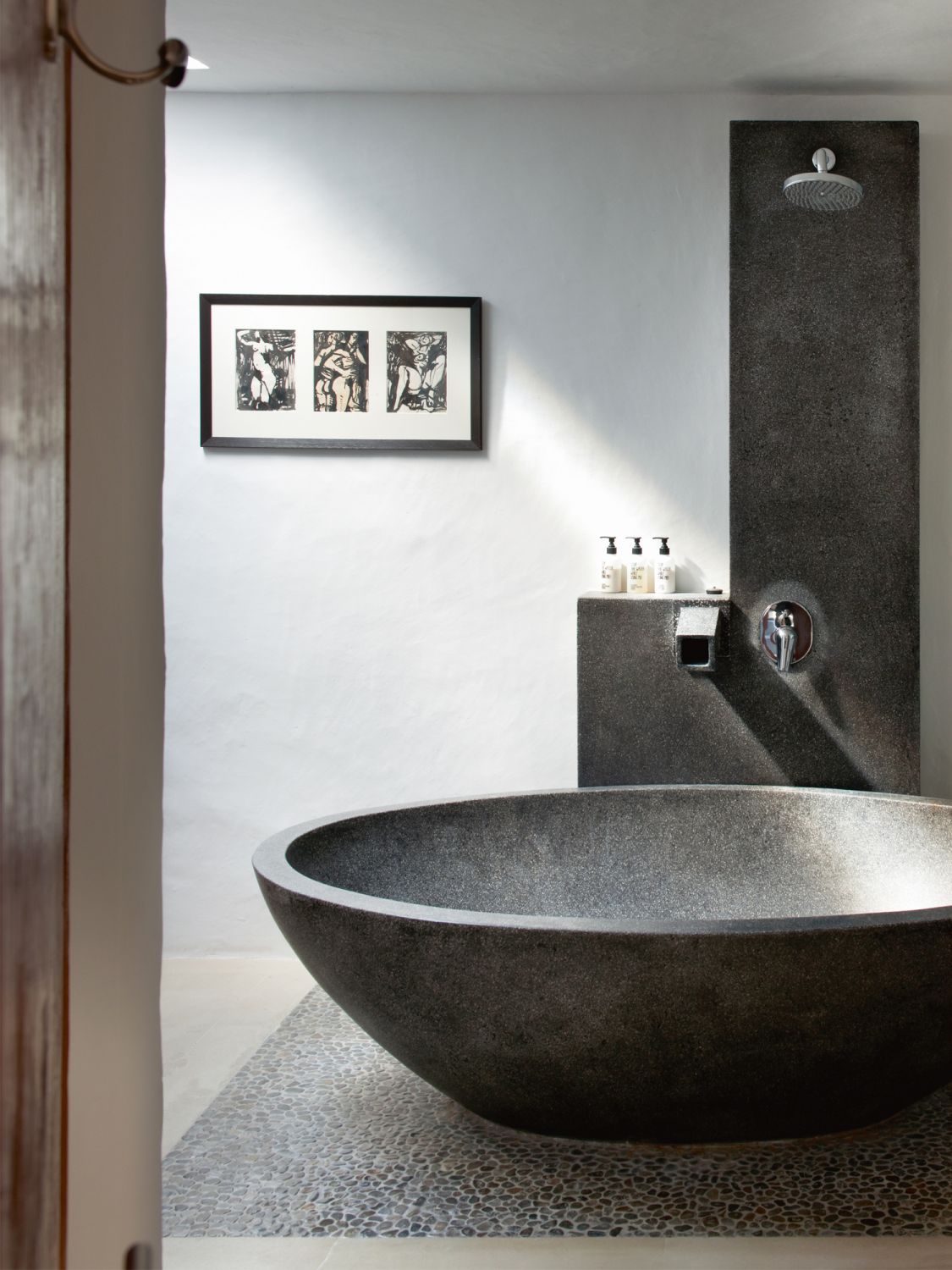 This bathroom is clad in a monochromatic colour scheme that fosters a sense of calm