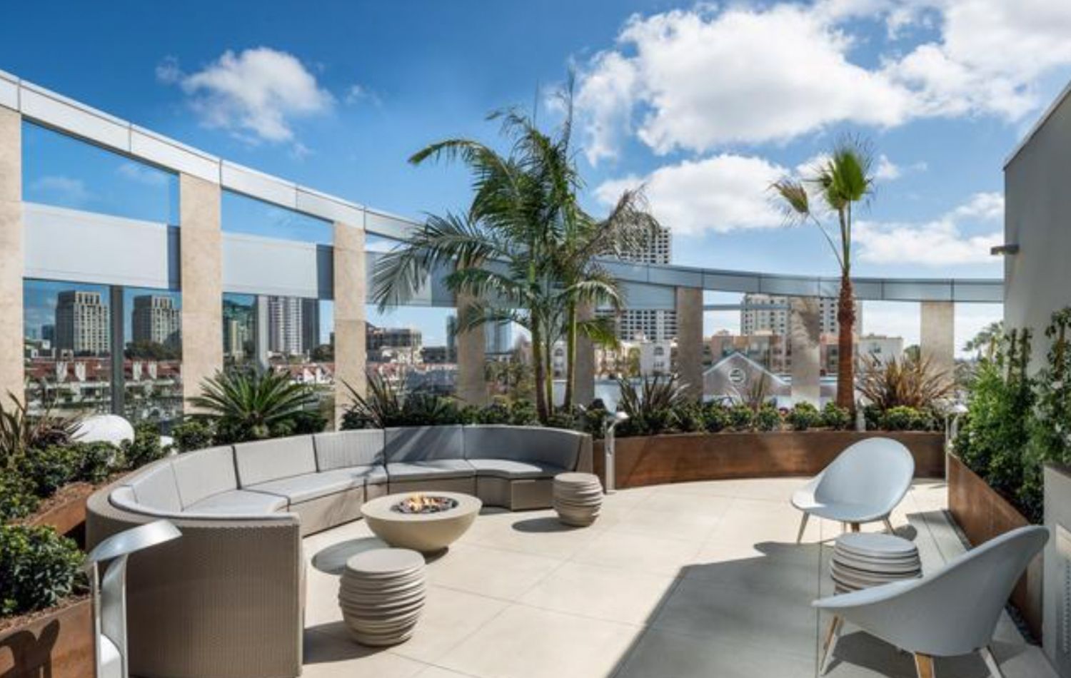 The apartment complex boasts a rooftop area with panoramic views of the cityscape