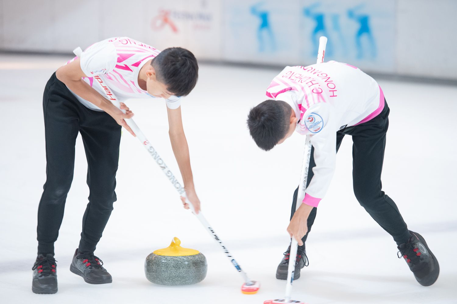 Curling is a sport played on ice that involves guiding a heavy stone towards a target