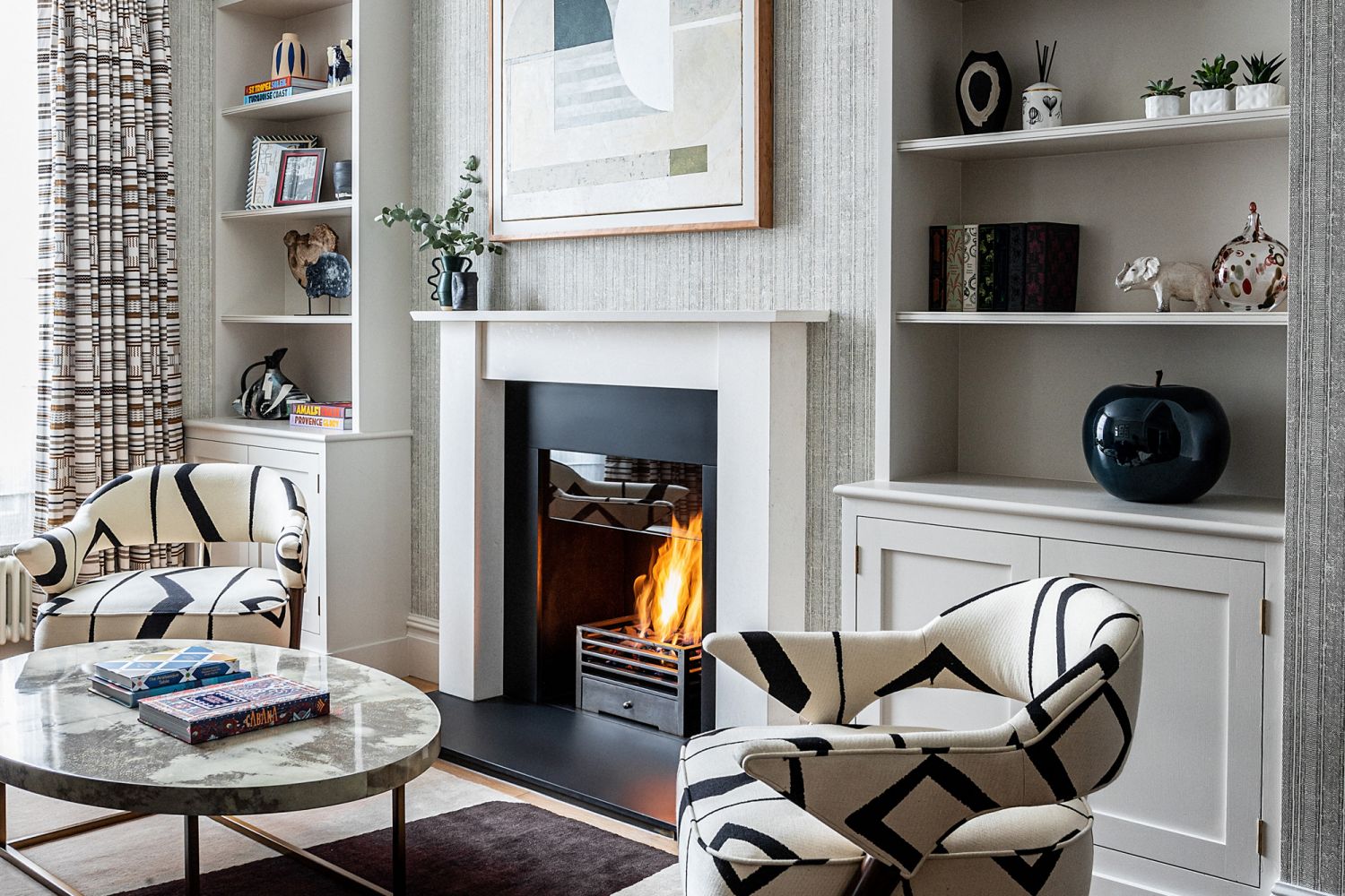 The geometric print on the armchairs immediately catches the eye