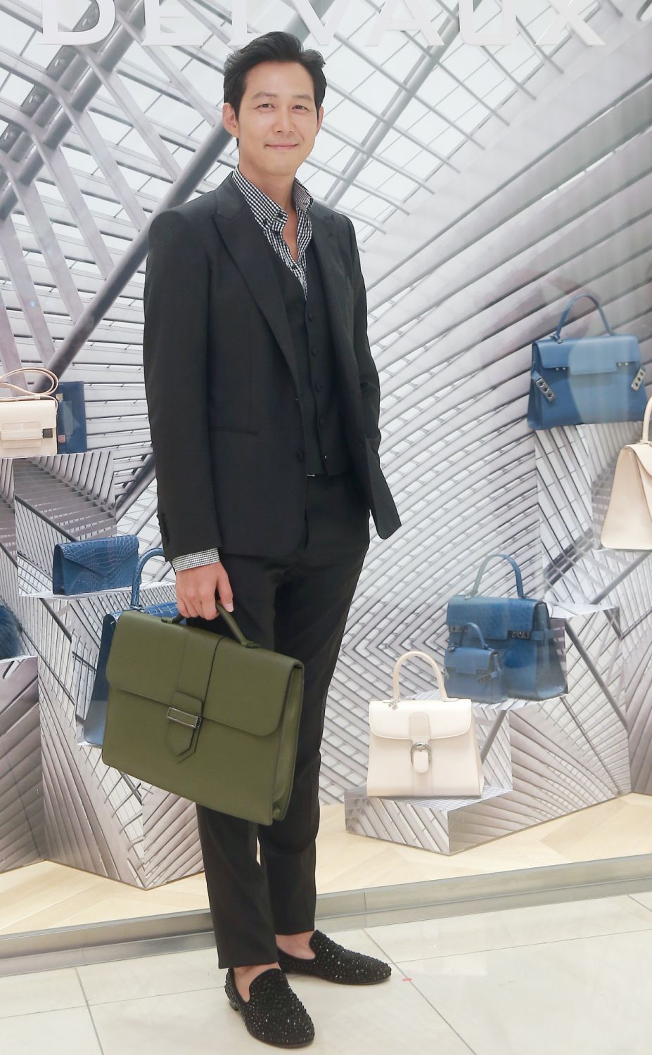 SEOUL, SOUTH KOREA - AUGUST 07:  Lee Jung-Jae poses for photographs during the Delvaux 2015/2016 F/W collection presentation at Hyundai department store on August 7, 2015 in Seoul, South Korea.  (Photo by ilgan Sports/Multi-Bits via Getty Images)