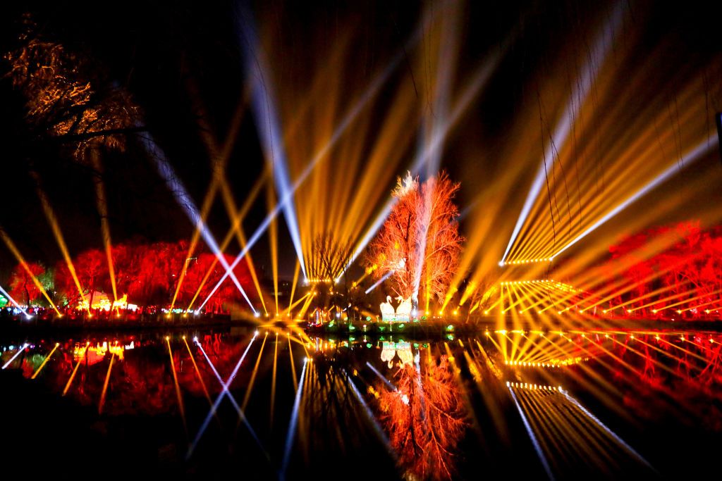 ZHANGYE, CHINA - FEBRUARY 13, 2021 - Residents watch a 3D light show during the Spring Festival in Zhangye, northwest China's Gansu Province, Feb 13, 2021.- PHOTOGRAPH BY Costfoto / Barcroft Studios / Future Publishing (Photo credit should read Costfoto/Barcroft Media via Getty Images)