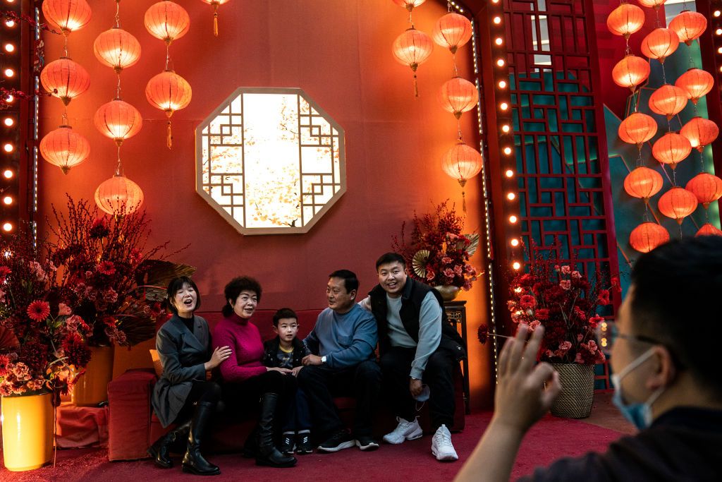 WUHAN, CHINA - FEBRUARY 16: (CHINA OUT) A family poses for pictures in a Shopping Mall during the fifth day of Spring Festival on February 16, 2021 in Wuhan, Hubei Province, China. China is marking the Spring Festival which begins with the Lunar New Year on February 12, ushering in the Year of the Ox, and with no recorded cases of COVID-19 community transmission since May 2020, life for residents in Wuhan is gradually returning to normal. (Photo by Getty Images)