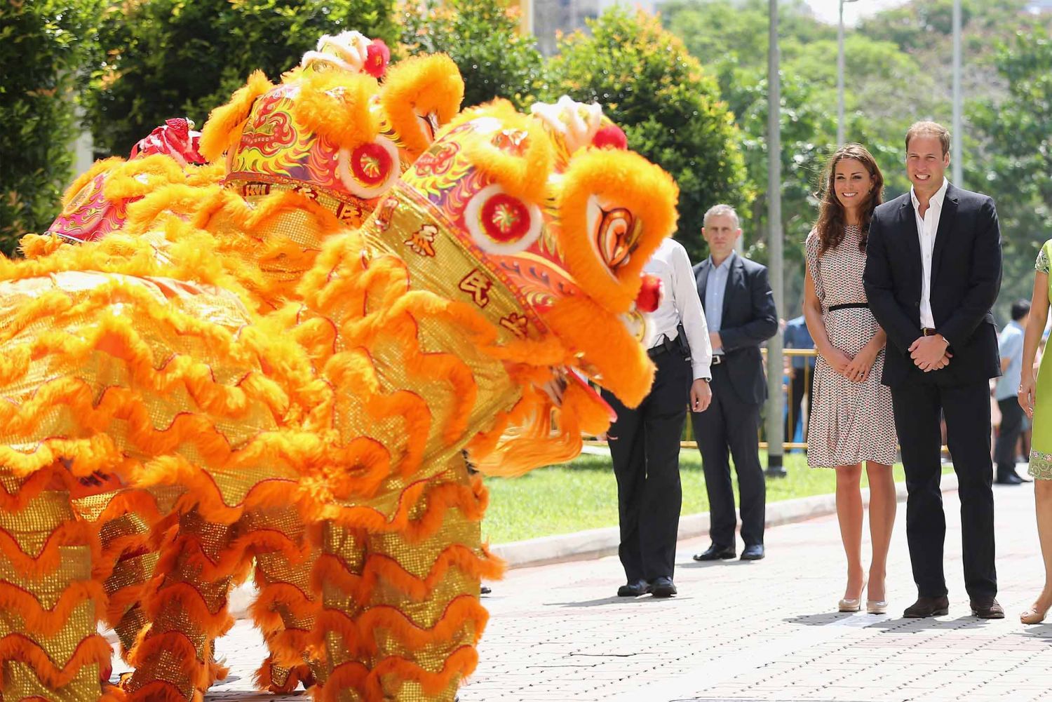 The Duchess of Cambridge and Prince William watch a dancing dragon as they attend a cultural event in Queenstown on day 2 of their Diamond Jubilee Tour of the Far East in Singapore. (Photo: Getty Images)