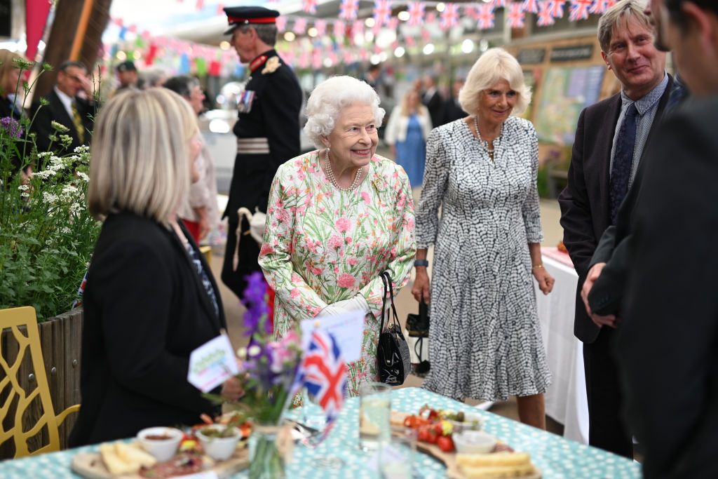 ST AUSTELL, ENGLAND - JUNE 11: Queen Elizabeth II (C) smiles as she meets people from communities across Cornwall at an event in celebration of The Big Lunch initiative at The Eden Project during the G7 Summit on June 11, 2021 in St Austell, Cornwall, England. UK Prime Minister, Boris Johnson, hosts leaders from the USA, Japan, Germany, France, Italy and Canada at the G7 Summit. This year the UK has invited India, South Africa, and South Korea to attend the Leaders' Summit as guest countries as well as the