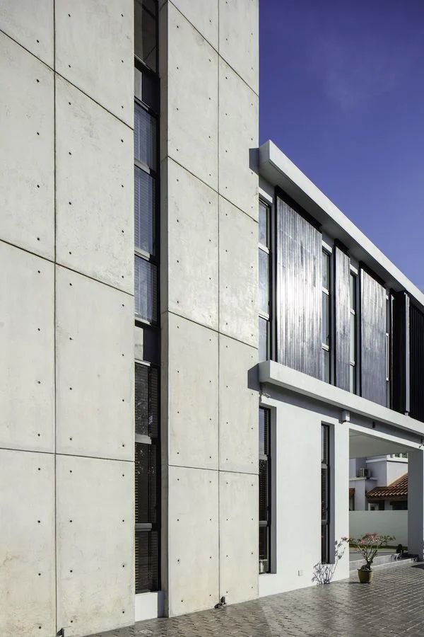 Architect Choo Gim Wah created a striking concrete facade for the exterior of this abode