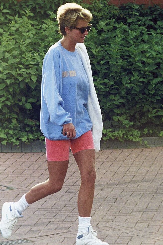 LONDON, ENGLAND - AUGUST 24: Diana, Princess of Wales, wearing a pale blue sweatshirt, pink cycling shorts and sunglasses, leaves Chelsea Harbour Club on August 24, 1994 in London, United Kingdom. (Photo by Anwar Hussein/Getty Images)