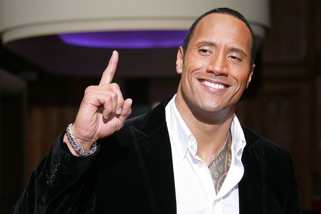 US actor Dwayne Douglas Johnson aka The Rock attends a photocall for "Doom" in Paris. (Photo by Stephane Cardinale/Corbis via Getty Images)