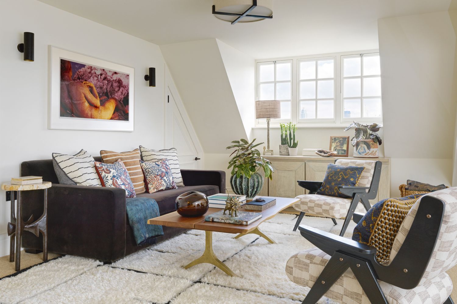 The sitting room sports an earthy scheme and vintage finds including lamps sourced from Talisman in London