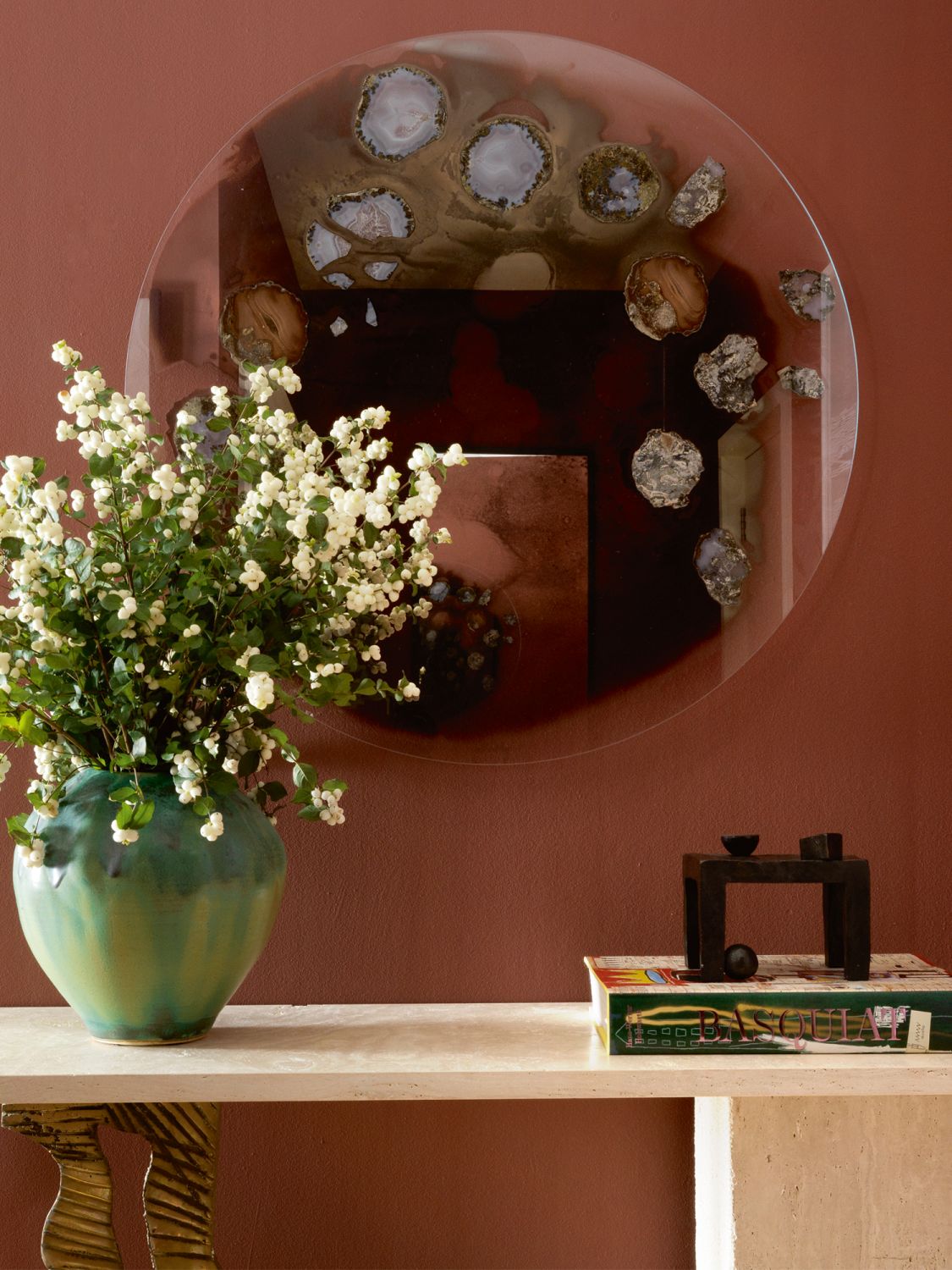 The rosy hues in the living area deepen to coral tones in this nook of the home