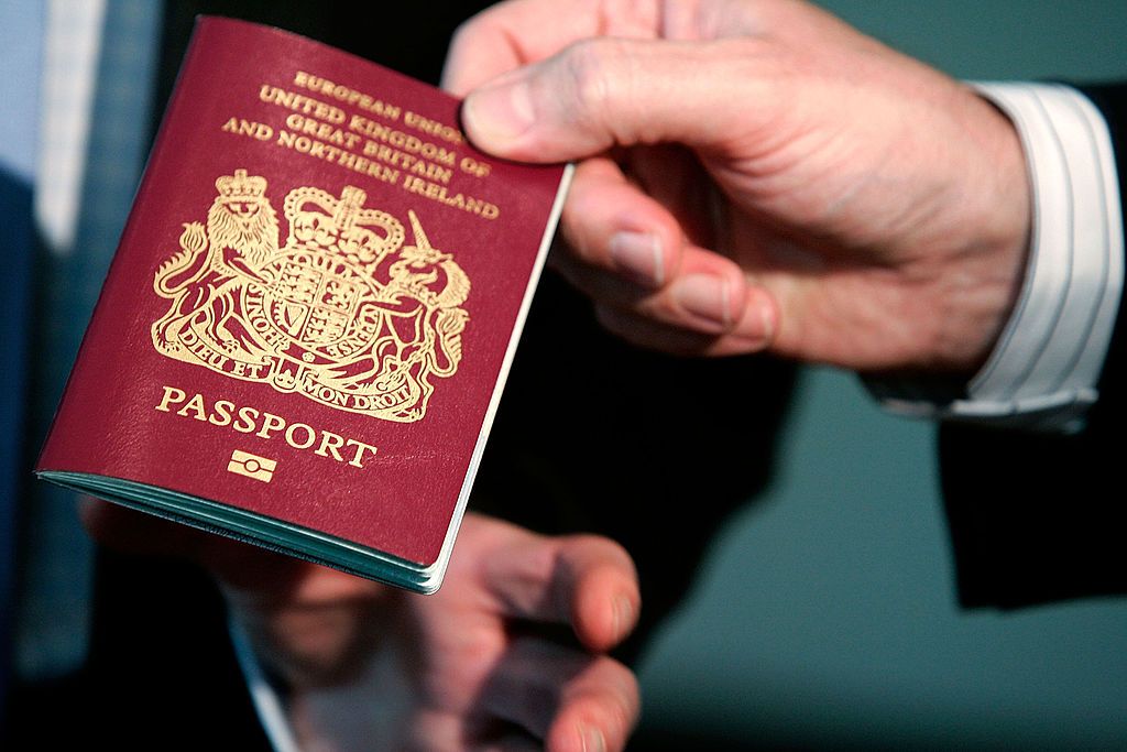 WASHINGTON - OCTOBER 24: A new British biometric European Union passport, which is embedded with a microchip, is shown during a news briefing at the British Embassy October 24, 2005 in Washington, DC. "The new British biometric passport contains features such as an enhanced security chip which will help to make international travel as safe and efficient as possible," said British Ambassador to the United States, Sir David Manning. (Photo by Alex Wong/Getty Images)
