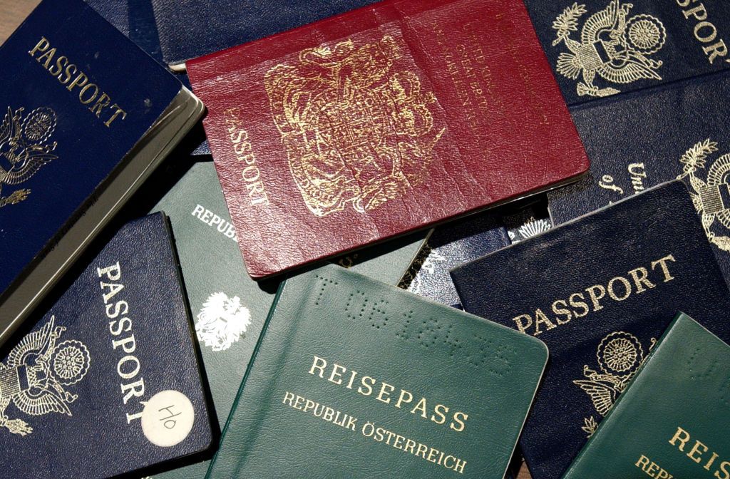 SAN FRANCISCO - JUNE 14: Counterfeit passports are shown at San Francisco International Airport June 14, 2002 in California. At more than 300 ports of entry across the U.S., a new system known as DataShare is being used to enable U.S. Immigration and Naturalization Service (INS) inspectors to see biographical information and photographs of visa holders who receive their documents at consular posts around the world. (Photo by Justin Sullivan/Getty Images)