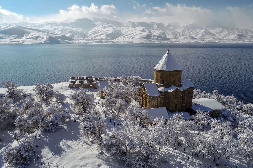 VAN, TURKIYE - JANUARY 15: A photo shows an aerial view of the snow covered church in Akdamar Island near Lake Van after heavy snowfall during winter season in Gevas district of Van, Turkiye on January 15, 2022. (Photo by Ozkan Bilgin/Anadolu Agency via Getty Images)