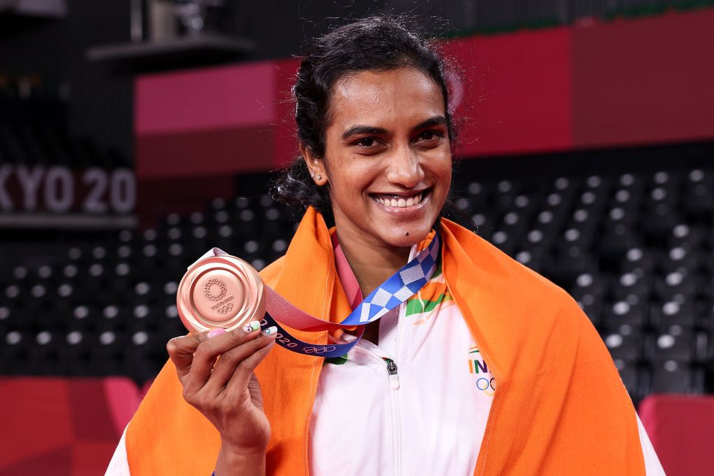 CHOFU, JAPAN - AUGUST 01: Bronze medalist Pusarla V. Sindhu of Team India poses for camera with her medal during the medal ceremony for the Womenâs Singles badminton event on day nine of the Tokyo 2020 Olympic Games at Musashino Forest Sport Plaza on August 01, 2021 in Chofu, Tokyo, Japan. (Photo by Lintao Zhang/Getty Images)