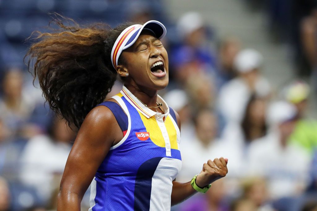 NEW YORK, NY - AUGUST 29: Naomi Osaka of Japan reacts against Angelique Kerber of Germany during their first round Women's Singles match on Day Two of the 2017 US Open at the USTA Billie Jean King National Tennis Center on August 29, 2017 in the Flushing neighborhood of the Queens borough of New York City. (Photo by Elsa/Getty Images)