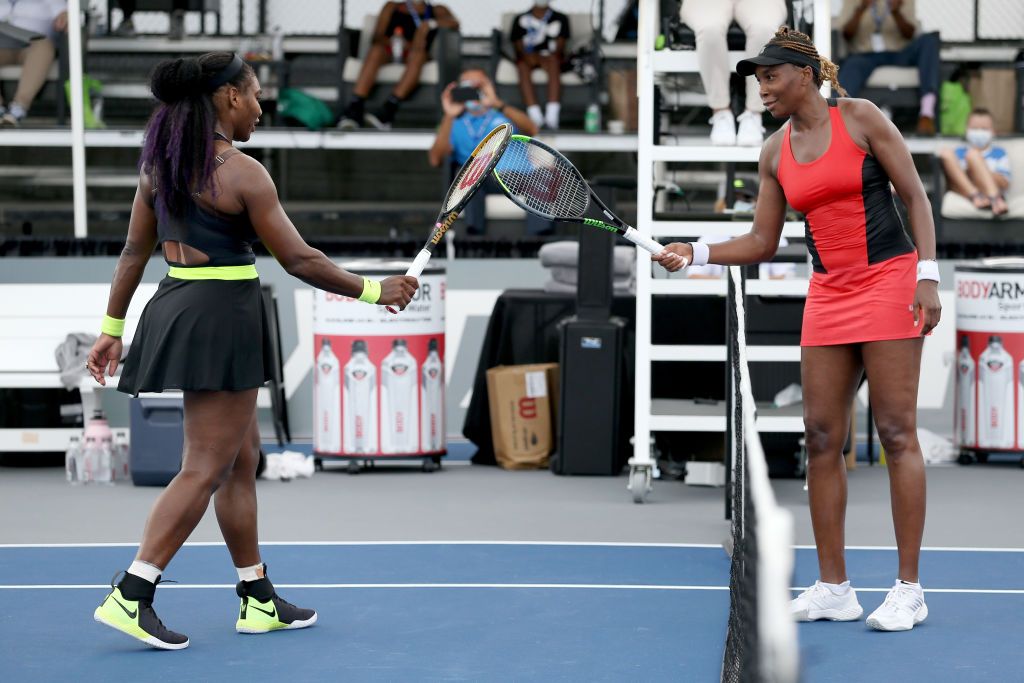 LEXINGTON, KENTUCKY - AUGUST 13: Serena Williams (L) and Venus Williams touch rackets after Serena Williams defeated Venus Williams 3-6, 6-3, 6-4 during Top Seed Open - Day 4 at the Top Seed Tennis Club on August 13, 2020 in Lexington, Kentucky. (Photo by Dylan Buell/Getty Images)