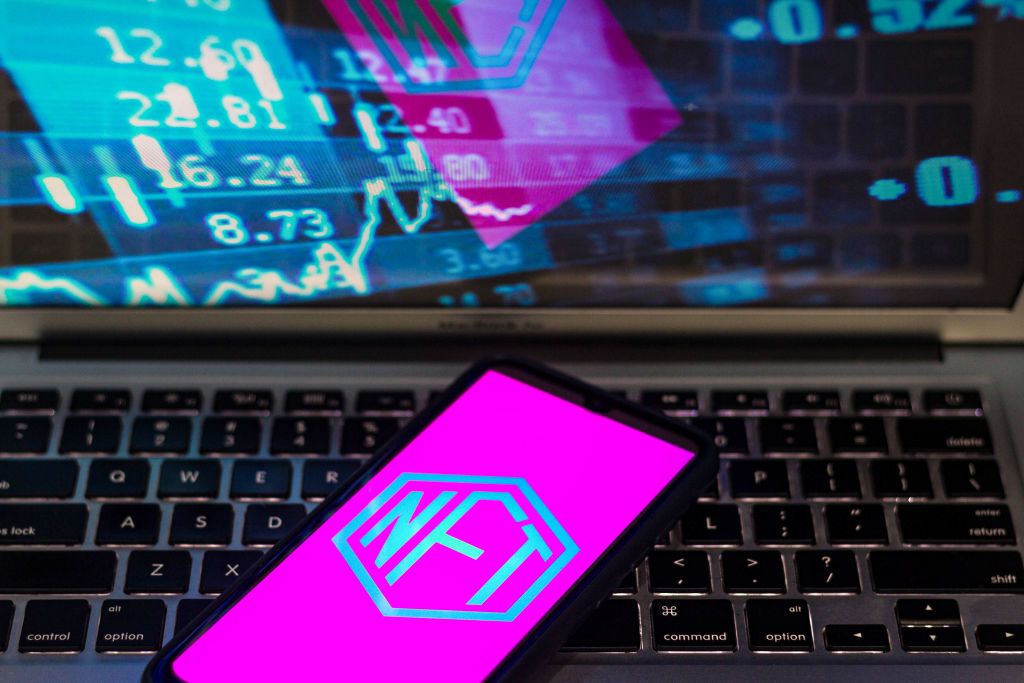 BRAZIL - 2021/08/31: In this photo illustration the Non-fungible token (NFT) logo seen displayed on a smartphone. (Photo Illustration by Rafael Henrique/SOPA Images/LightRocket via Getty Images)