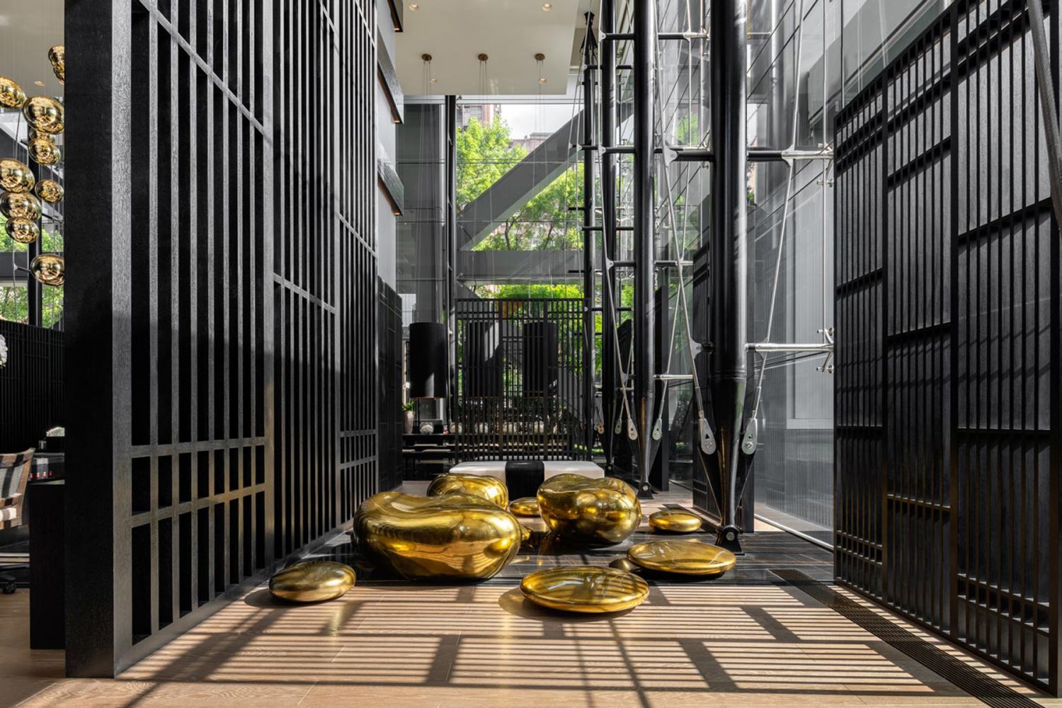 The lobby of One Park Taipei has an inviting atmosphere with a mixture of dark wood and lighter furnishings (Image: Kelly Hoppen)
