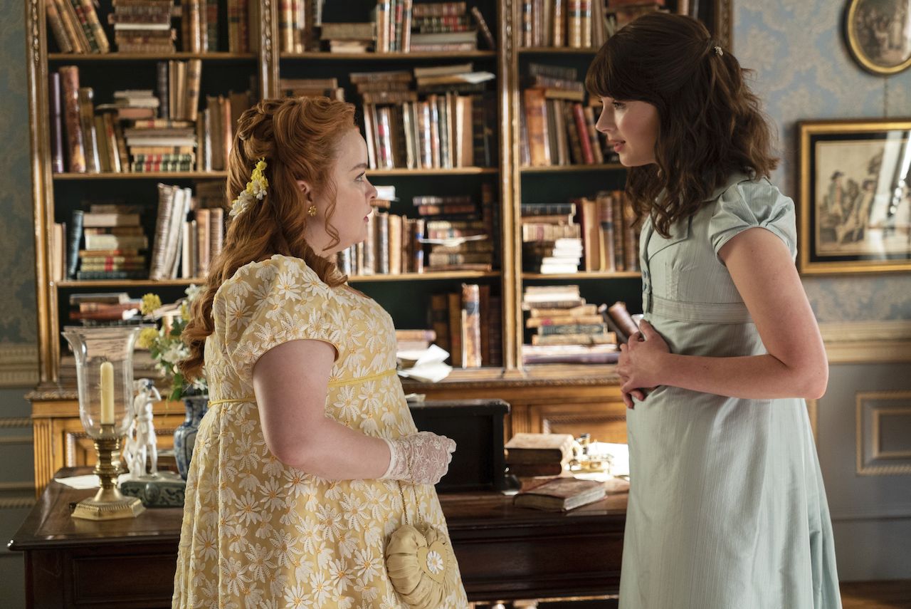 Bridgerton. (L to R) Nicola Coughlan as Penelope Featherington, Claudia Jessie as Eloise Bridgerton in episode 207 of Bridgerton. Cr. Liam Daniel/Netflix Â© 2022