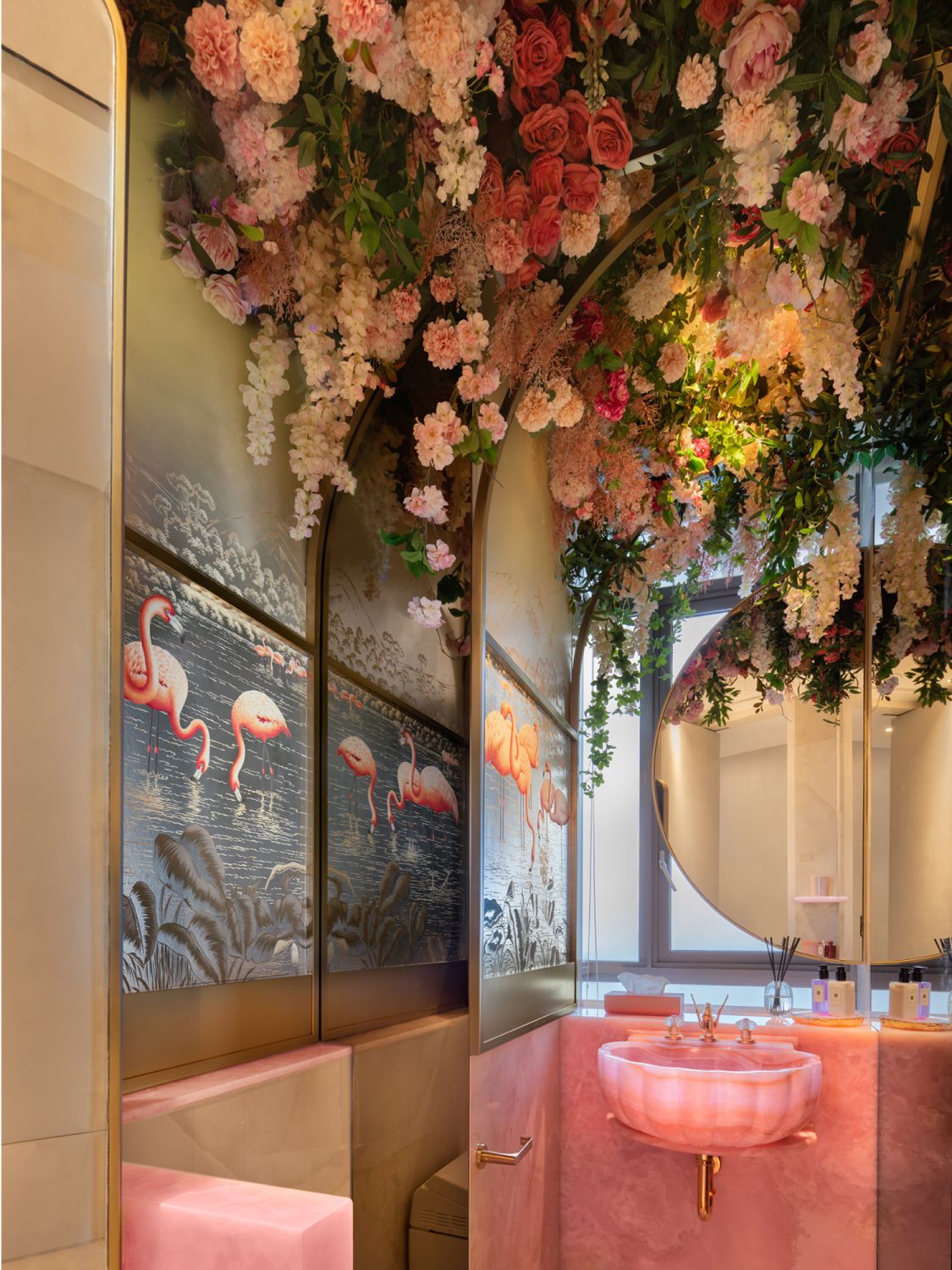 The stunning floral display in the powder room adds a vibrant energy to the abode