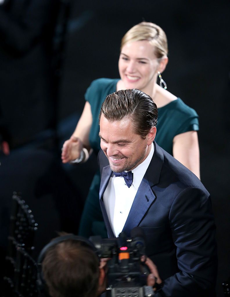 LOS ANGELES, CA - JANUARY 30: Actress Kate Winslet applauds as actor Leonardo DiCaprio accepts the award for Outstanding Performance by a Male Actor in a Leading Role for 'The Revenant' during The 22nd Annual Screen Actors Guild Awards at The Shrine Auditorium on January 30, 2016 in Los Angeles, California. 25650_018  (Photo by Christopher Polk/Getty Images for Turner)