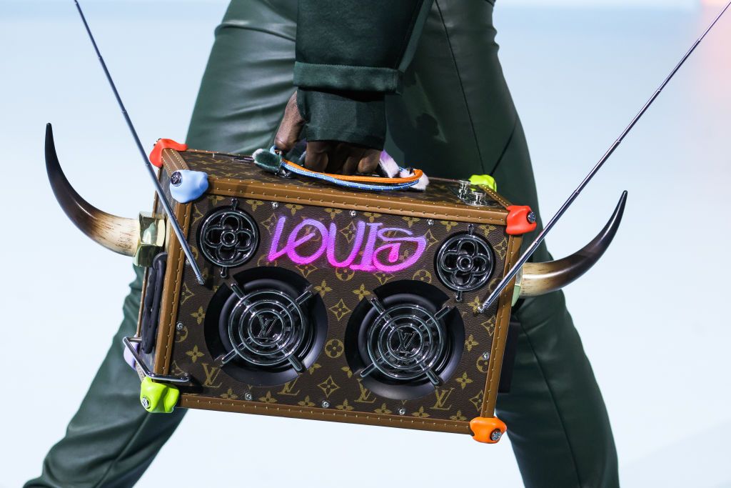 PARIS, FRANCE - JANUARY 20: (EDITORIAL USE ONLY - For Non-Editorial use please seek approval from Fashion House) A model, bag detail, walks the runway during the Louis Vuitton Menswear Fall/Winter 2022-2023 show as part of Paris Fashion Week on January 20, 2022 in Paris, France. (Photo by Victor Boyko/Getty Images)