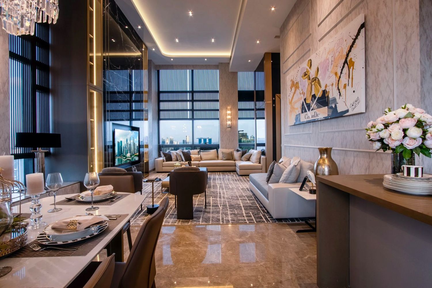 The living area is designed with a polished Noir Marquina marble feature wall, which adds an aura of elegance