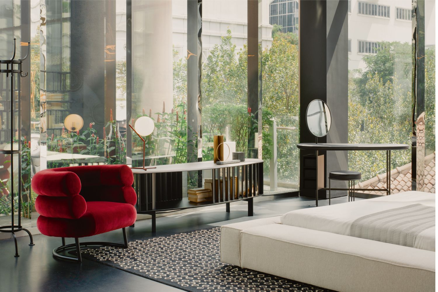 The space is designed with a medley of furnishings from Living Divani, accompanied with Glass Italia screens and accent pieces from Arflex and Moooi