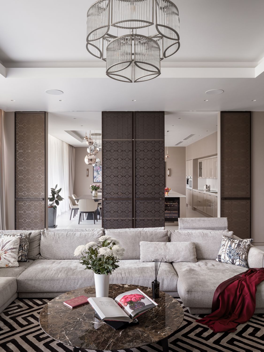 Sliding doors create a distinction between the living and dining spaces