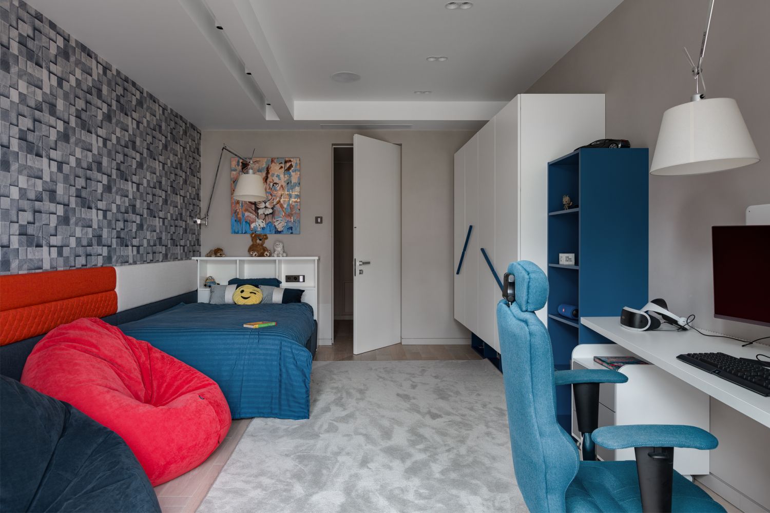 Blue and red dominate in the son's bedroom, with the vibrant colours bringing the space to life