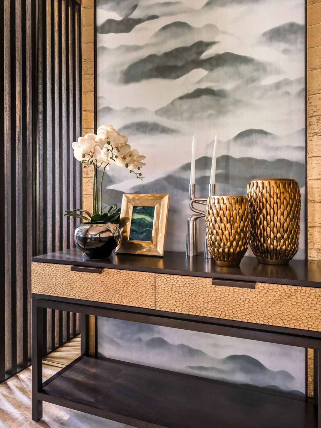 As seen in this mantel designed by Prestige Global Designs, orchids imbue any space with a touch of elegance
