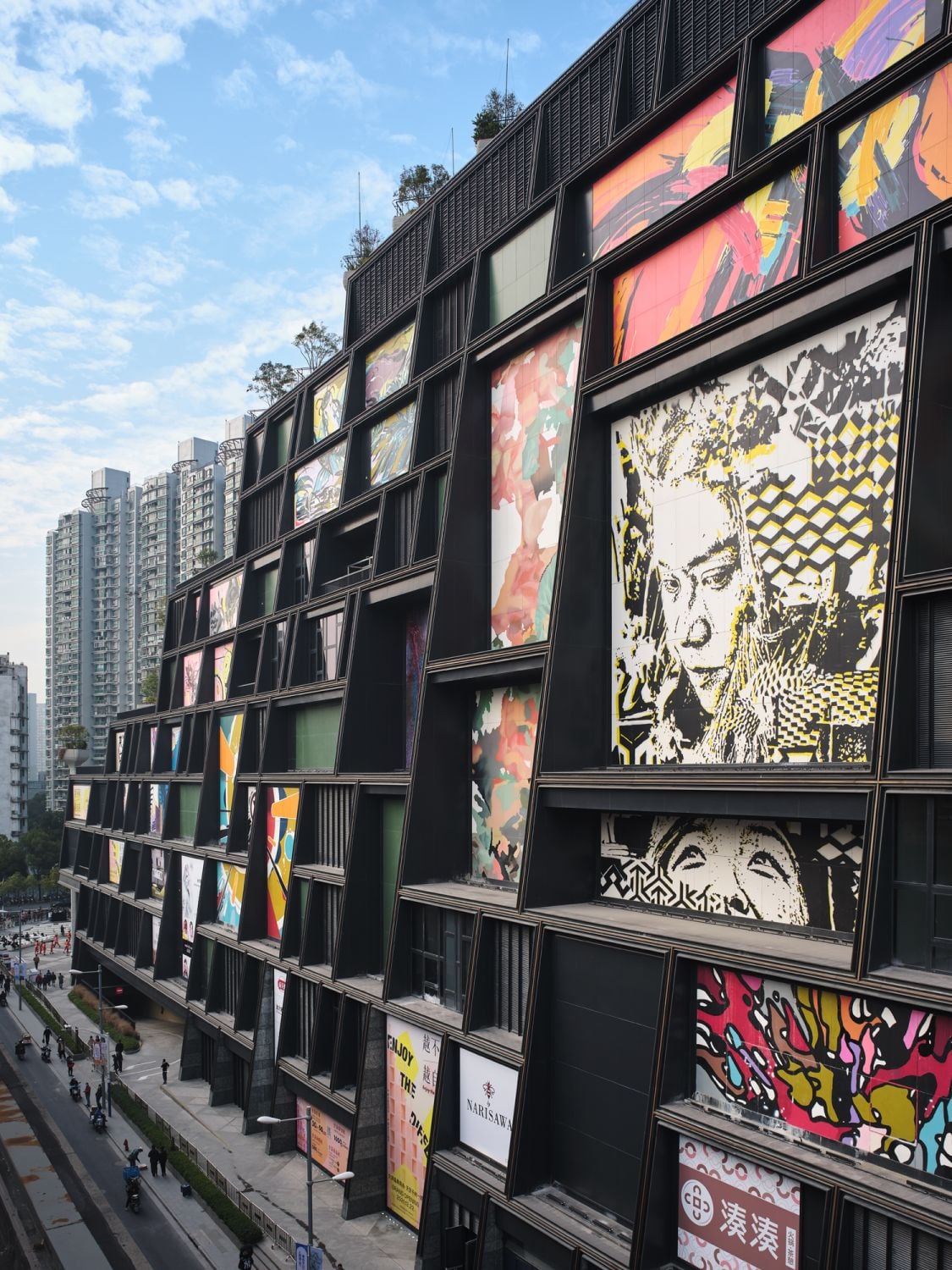 The street-facing wall of the building is covered in street art (Photography: Qingyan Zhu)