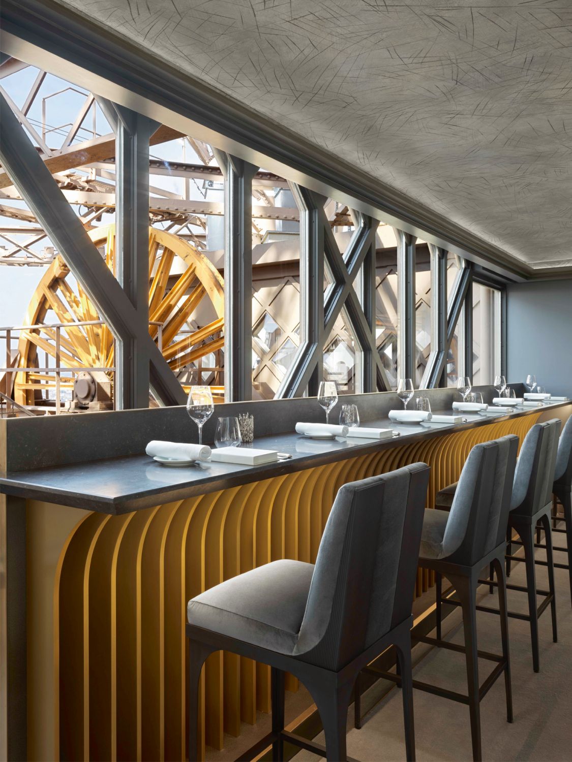 These counter seats in Le Jules Verne look out to the industrial beauty of the Eiffel Tower