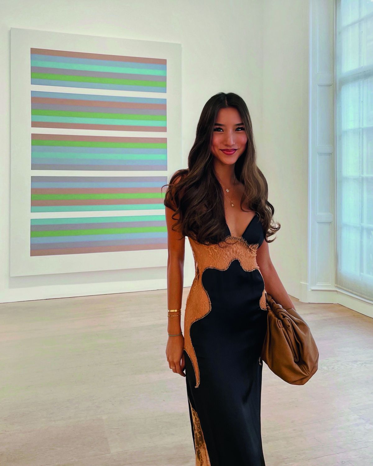 Claudia ChengClaudia_2: Off White dress, pictured with painting by Bridget Riley