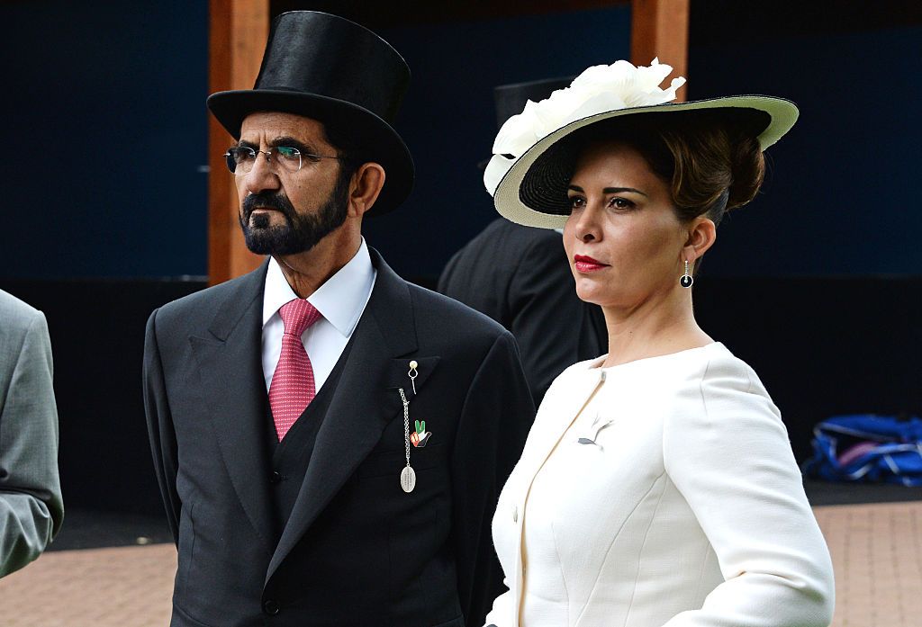 LONDON, ENGLAND - JUNE 04:  Sheikh Mohammed bin Rashid Al Maktoum (L) and Princess Haya bint Al Hussein attend Derby Day during the Investec Derby Festival, celebrating The Queen's 90th Birthday, at Epsom Downs Racecourse on June 4, 2016 in London, England.  (Photo by David M. Benett/Dave Benett/Getty Images for Investec)
