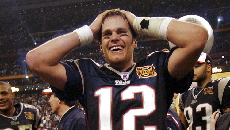 New England Patriots quarterback Tom Brady smiles after the Patriots beat the Carolina Panthers 32-29 in Super Bowl XXXVIII in Houston, Sunday, Feb. 1, 2004. (AP Photo/Dave Martin)