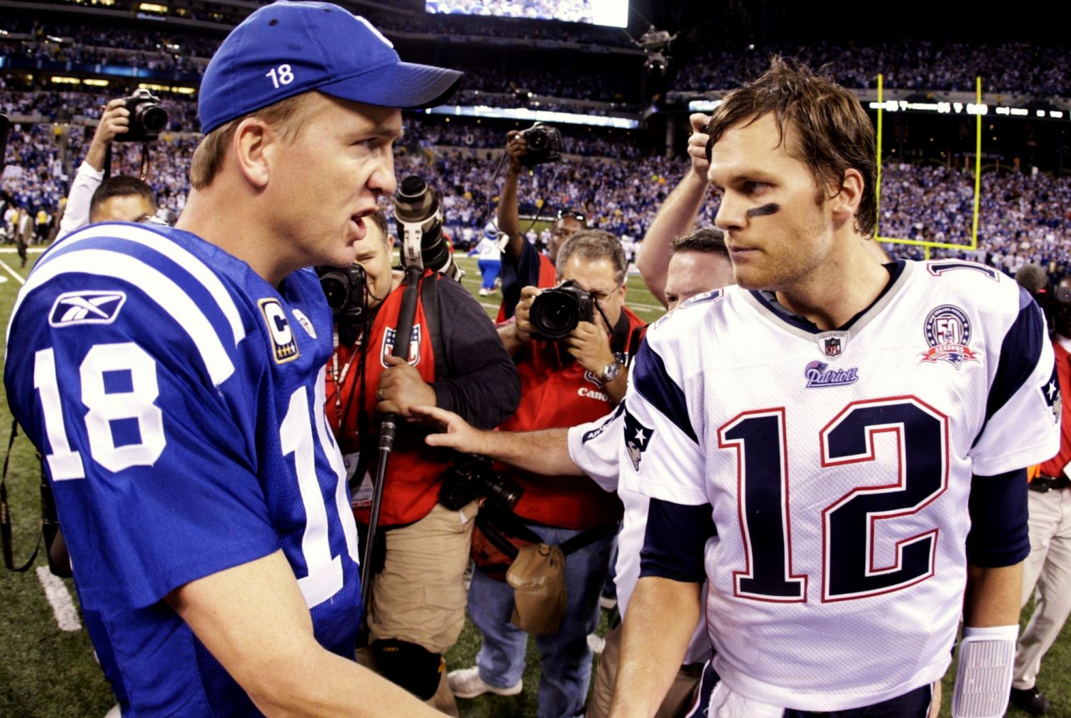 INDIANAPOLIS - NOVEMBER 15: Quarterback Peyton Manning #18 of the Indianapolis Colts greets Tom Brady #12 of the New England Patriots after the game at Lucas Oil Stadium on November 15, 2009 in Indianapolis, Indiana. The Colts won the game 35-34. (Photo by Jamie Squire/Getty Images)