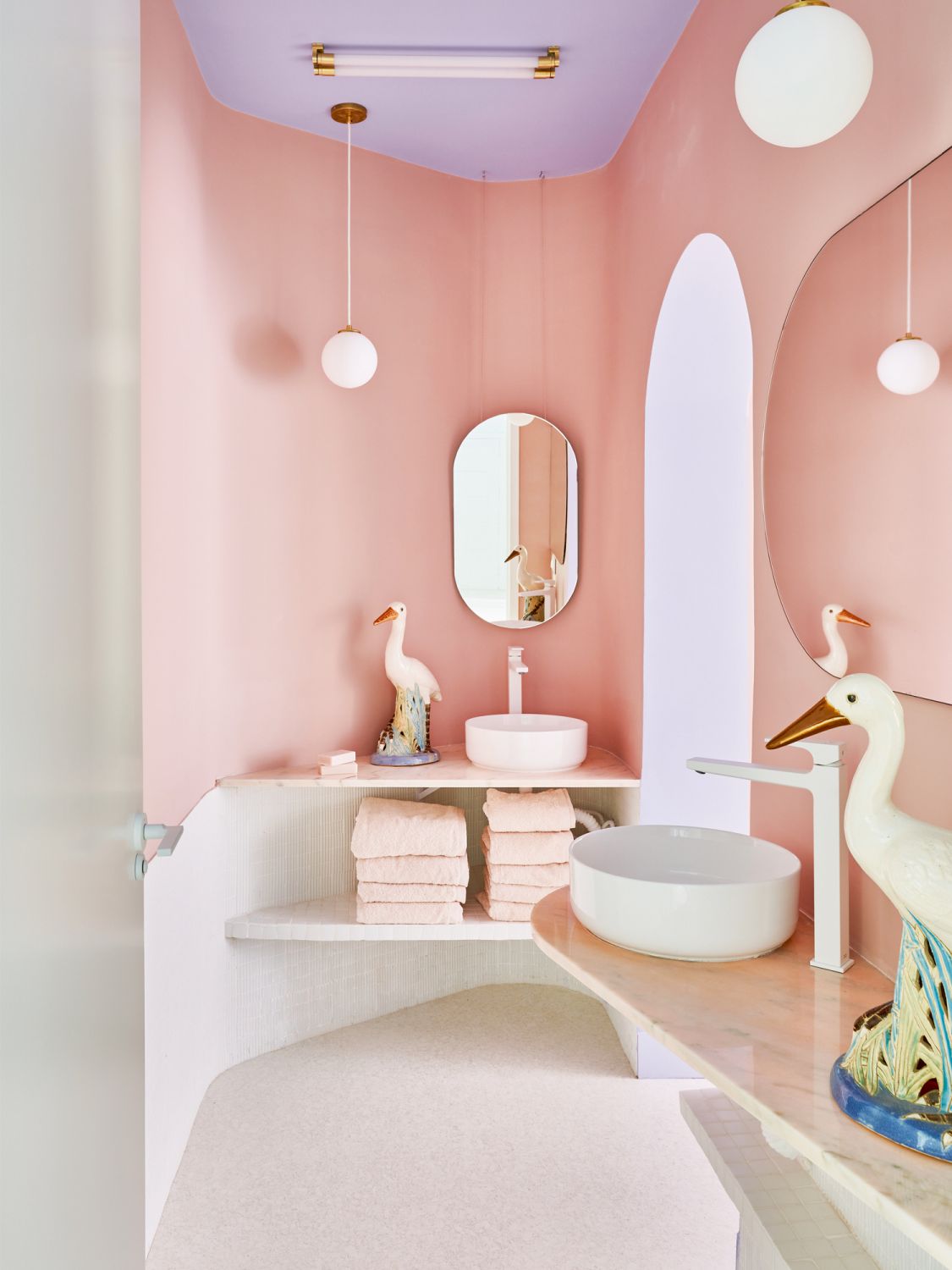 Ceramic heron figurines from the sixties add a dose of fun to the master bathroom
