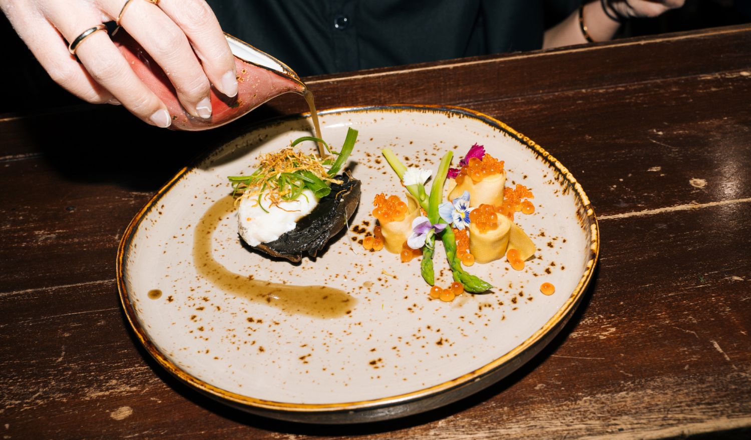 Steamed cod fish rested on whole Portobello with chive and crispy fine ginger served with asparagus, yuba ribbons, radish, salmon roe, micro greens and Chinese herb-infused dashi.
