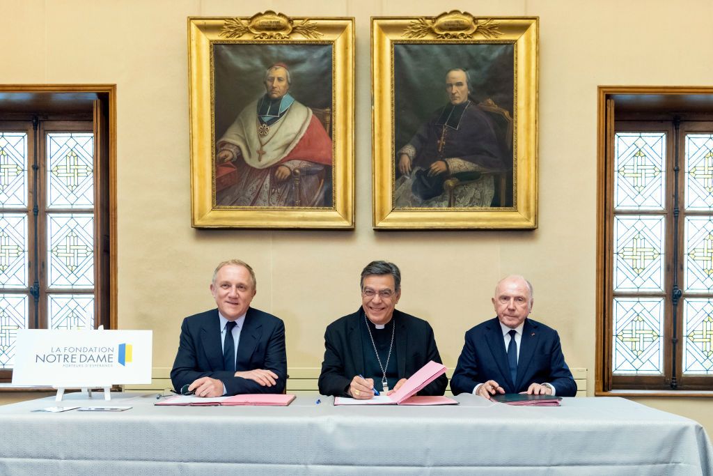 PARIS, France â October 01 : Francois-Henri Pinault, Paris Archbishop Michel Petit and Francois Pinault sign paper work for a 100 millions euros donation to Foundation Notre Dame aiming to restore Notre Dame on October 1, 2019 in Paris, France.