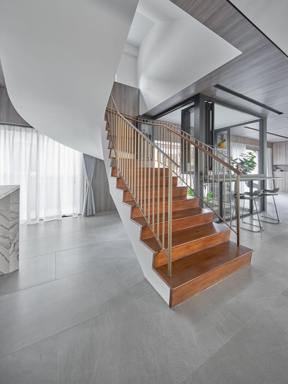 This curved staircase is among the original architectural elements preserved in the house