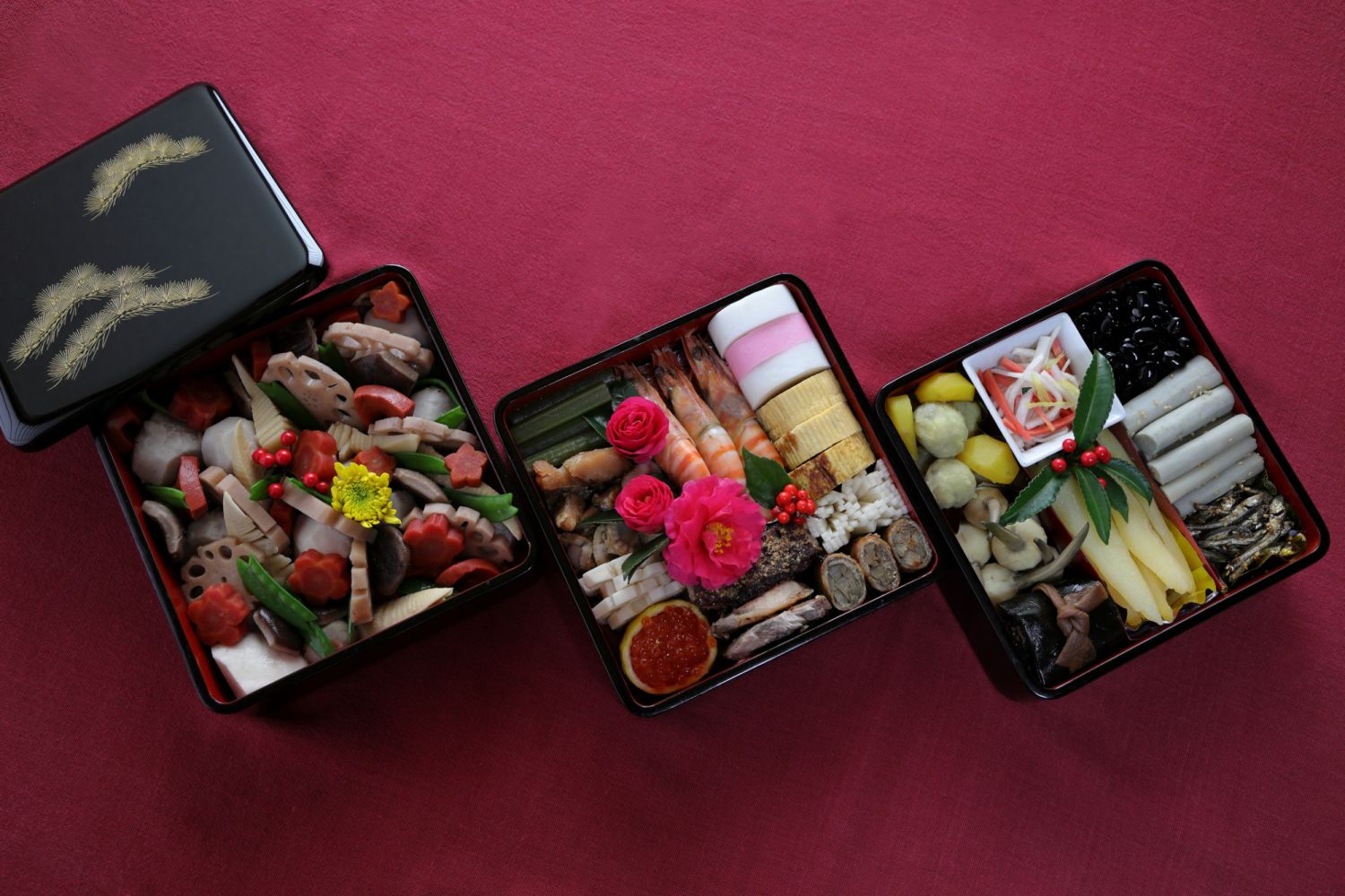 Special homemade dishes for celebrate the New Year, Kansai region style Osechi. The Osechi was completed on New Year's Eve (Oomisoka) and the photo was taken on New Year's Day. The Osechi dishes include Plain Rolled Omelette made with soup stock made from konbu kelp and dried bonito(Datemaki) Candied Chestnut and Mashed Sweet Potatoes (Kuri Kinton) Candied Dried Sardines (Gomame) Simmered Sweet Black Soybeans (Kuromame) Herring Roe (Kazunoko) Daikon & Carrot Salad (Ko-haku Namasu) Pickled chrysanthemum shap