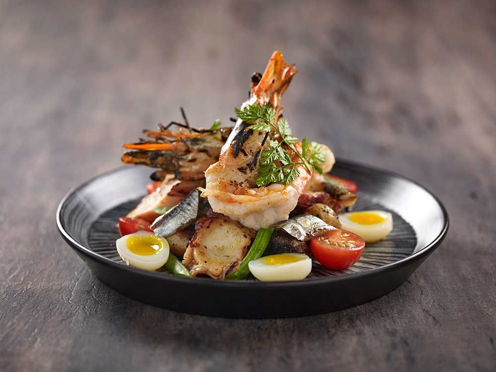 Prawn and octopus nicoise salad
