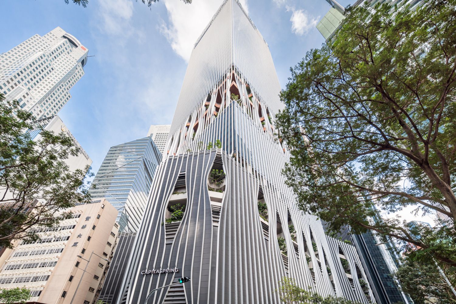 The building's striking facade features orthogonal pin-striped fins