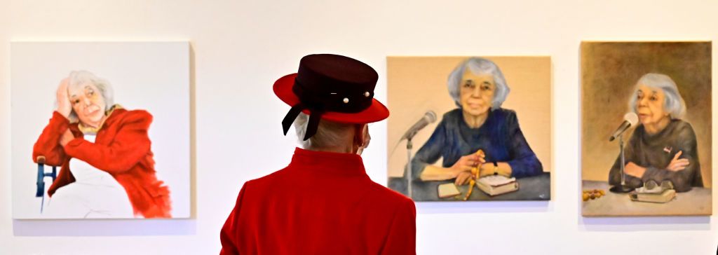 BERLIN, GERMANY - NOVEMBER 11: (EDITORIAL USE ONLY: MANDATORY MENTION OF THE ARTIST UPON PUBLICATION - TO ILLUSTRATE THE EVENT AS SPECIFIED IN THE CAPTION) Queen Margrethe II of Denmark looks at portraits of German Holocaust survivor Margot Friedlander as she visits the Literaturhaus (literature house) on November 11, 2021 in Berlin, Germany. The Danish queen and her son are conducting a state visit to Germany, including the country's federal capital, Berlin, and that of its largest state, Munich, from Nove