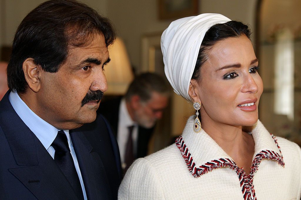 LONDON, UNITED KINGDOM - OCTOBER 27: (L-R) His Highness the Emir of the State of Qatar, Sheikh Hamad bin Khalifa Al Thani and his wife Sheikha Mozah bint Nasser Al-Missned walk together after visiting students from His Royal Highness Prince Charles' School of Traditional Arts at Clarence House on 27 October, 2010 in London, England. Sheikh Hamad bin Khalifa al-Thani and his wife are on a three-day state visit to the UK and are due to visit the 2012 Olympics site later today. (Photo by Jane Mingay - WPA Po
