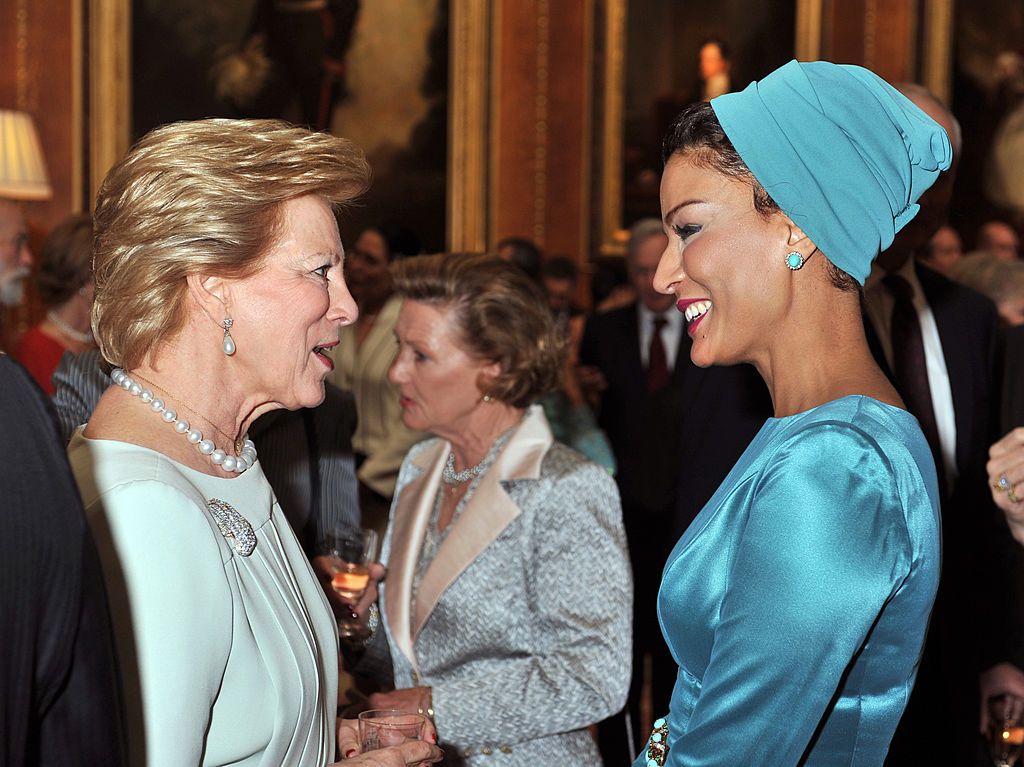WINDSOR, ENGLAND - MAY 18: Queen Anne Marie of Greece talks with Sheikha Moza Bint Nasser Al-Missned during a reception in the Waterloo Chamber, before her Sovereign Monarch's Jubilee lunch, at Windsor Castle, on May 18, 2012 in Windsor, England. (Photo by John Stillwell - WPA Pool/Getty Images)