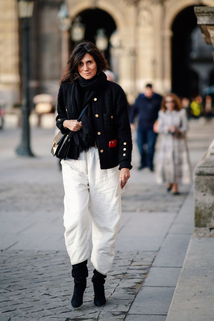 PARIS, FRANCE - MARCH 05: Emmanuelle Alt wears a military jacket with buttons, white pants, outside Louis Vuitton, during Paris Fashion Week Womenswear Fall/Winter 2019/2020, on March 05, 2019 in Paris, France. (Photo by Edward Berthelot/Getty Images)