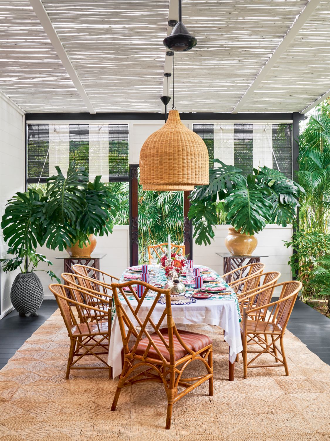 The dining area of the lanai features various rattan pieces