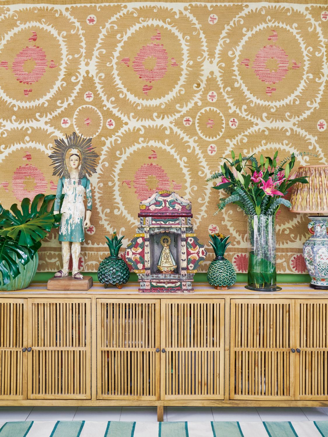 Mora collects suzanis—embroidered decorative tribal textiles from Central Asia—and this example in the living room is one of her antique finds